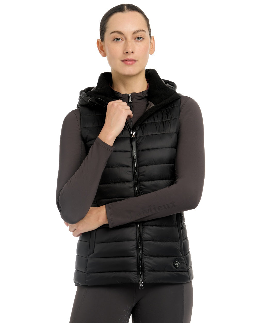 Black coloured LeMieux Tilly Hooded Puffer Gilet on white background 