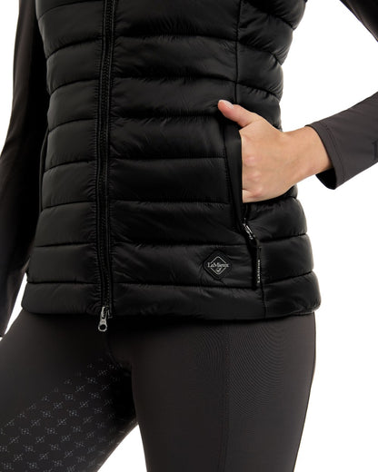 Black coloured LeMieux Tilly Hooded Puffer Gilet on white background 