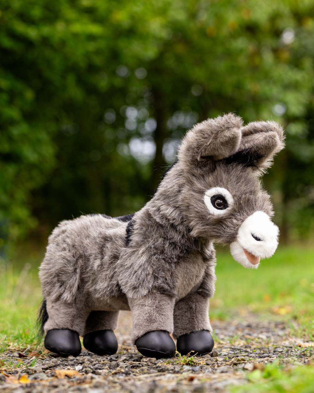 LeMieux Toy Donkey Daphne on blurry park background