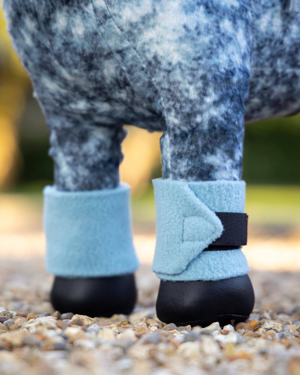 Glacier coloured LeMieux Toy Pony Bandages on blurry background 