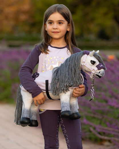 Blanca coloured LeMieux Toy Pony Blanca on garden background 