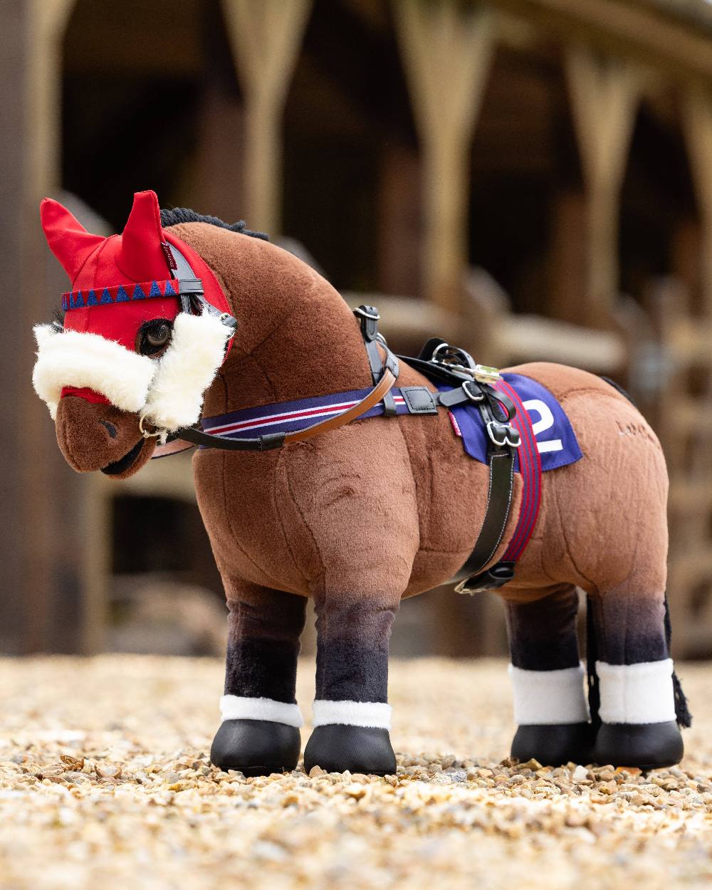 Black coloured LeMieux Toy Pony Racing Bridle Set on blurry background 