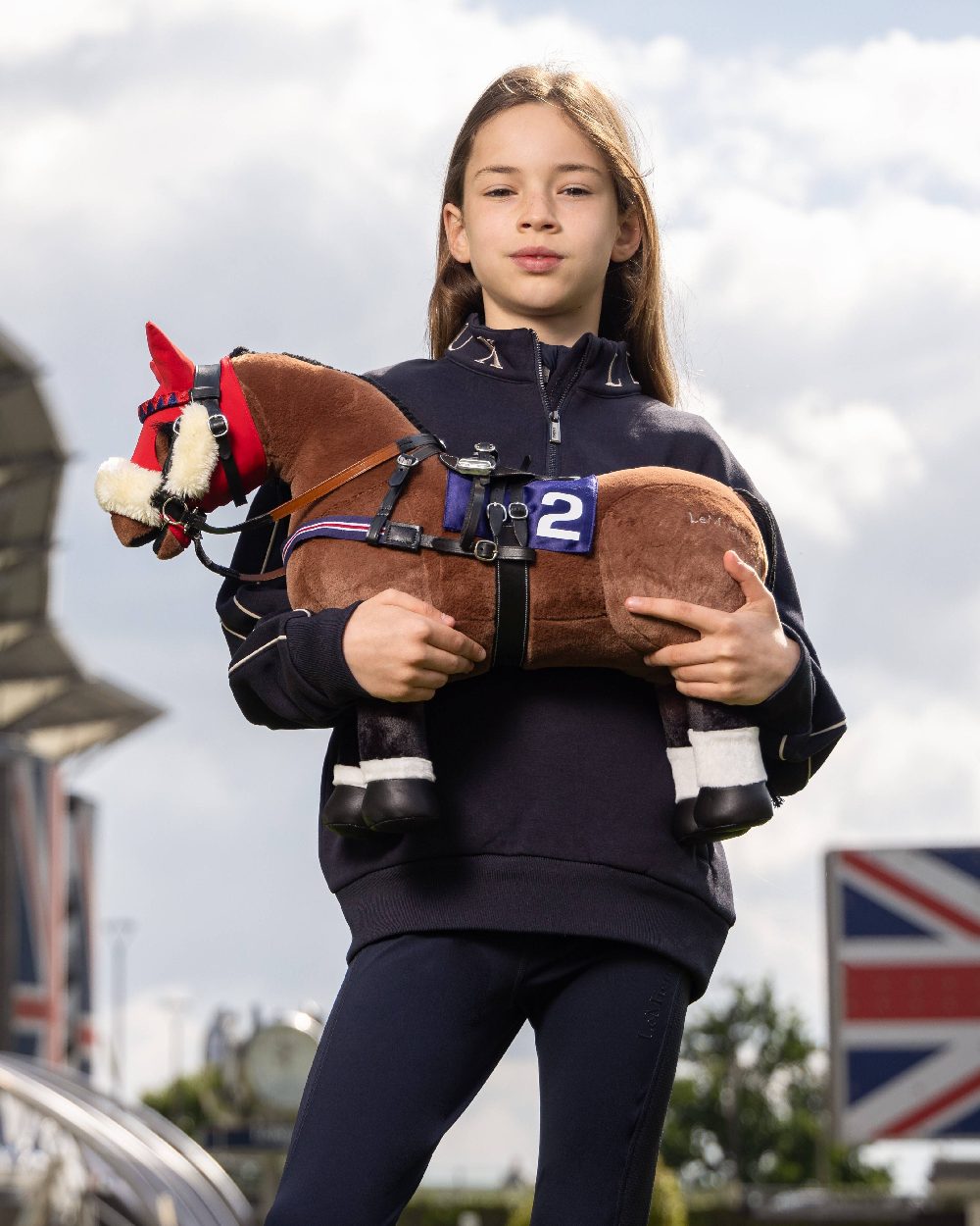 Black coloured LeMieux Toy Pony Racing Bridle Set with sky in background 