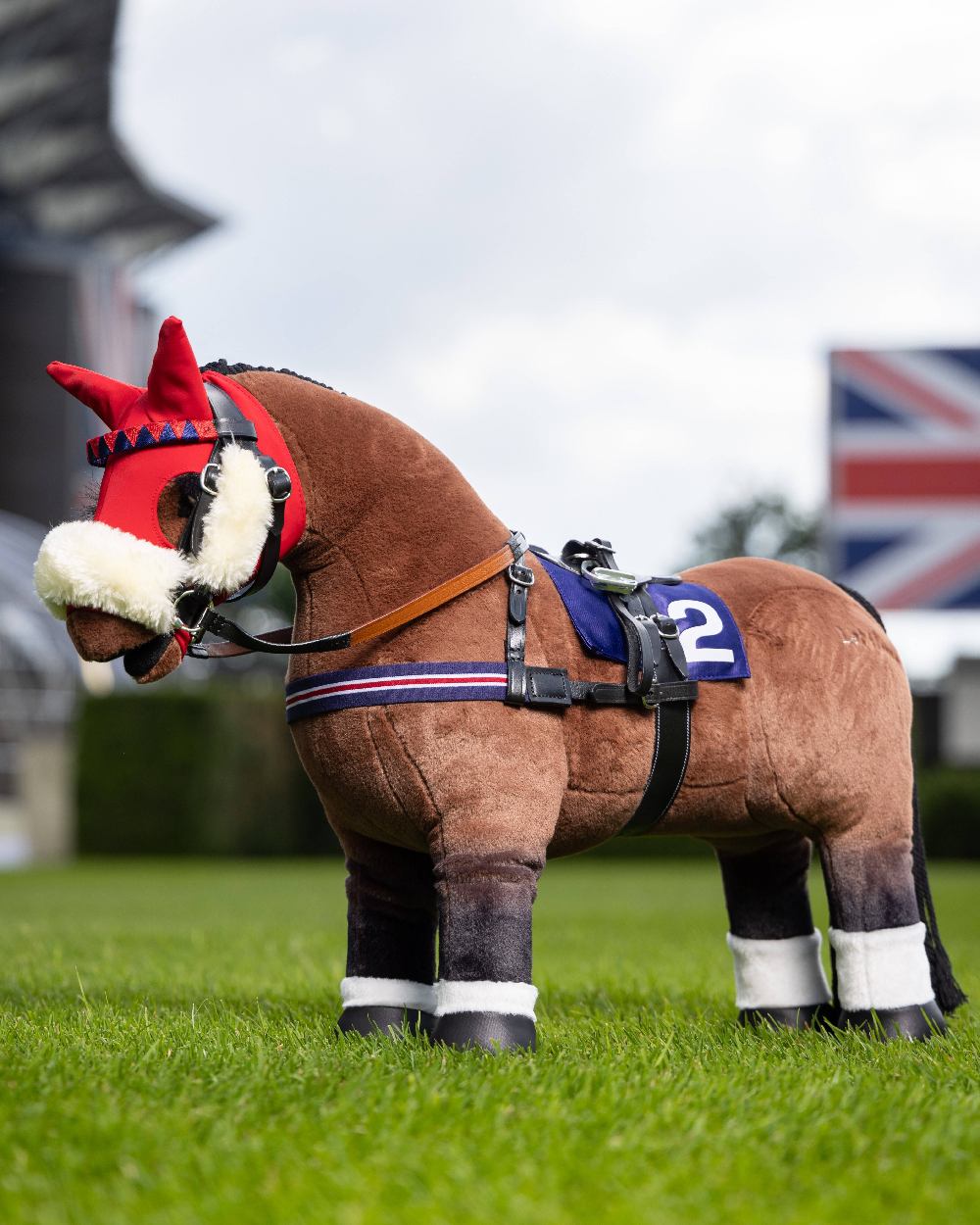 Black coloured LeMieux Toy Pony Racing Saddle Set on blurry background 