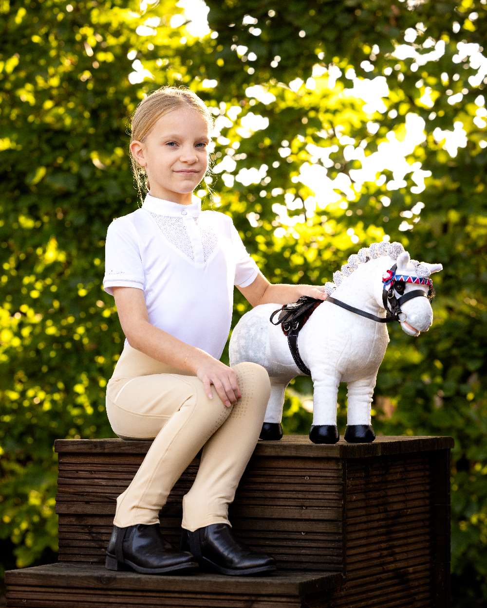 Black coloured LeMieux Toy Pony Showing Bridle on park background 