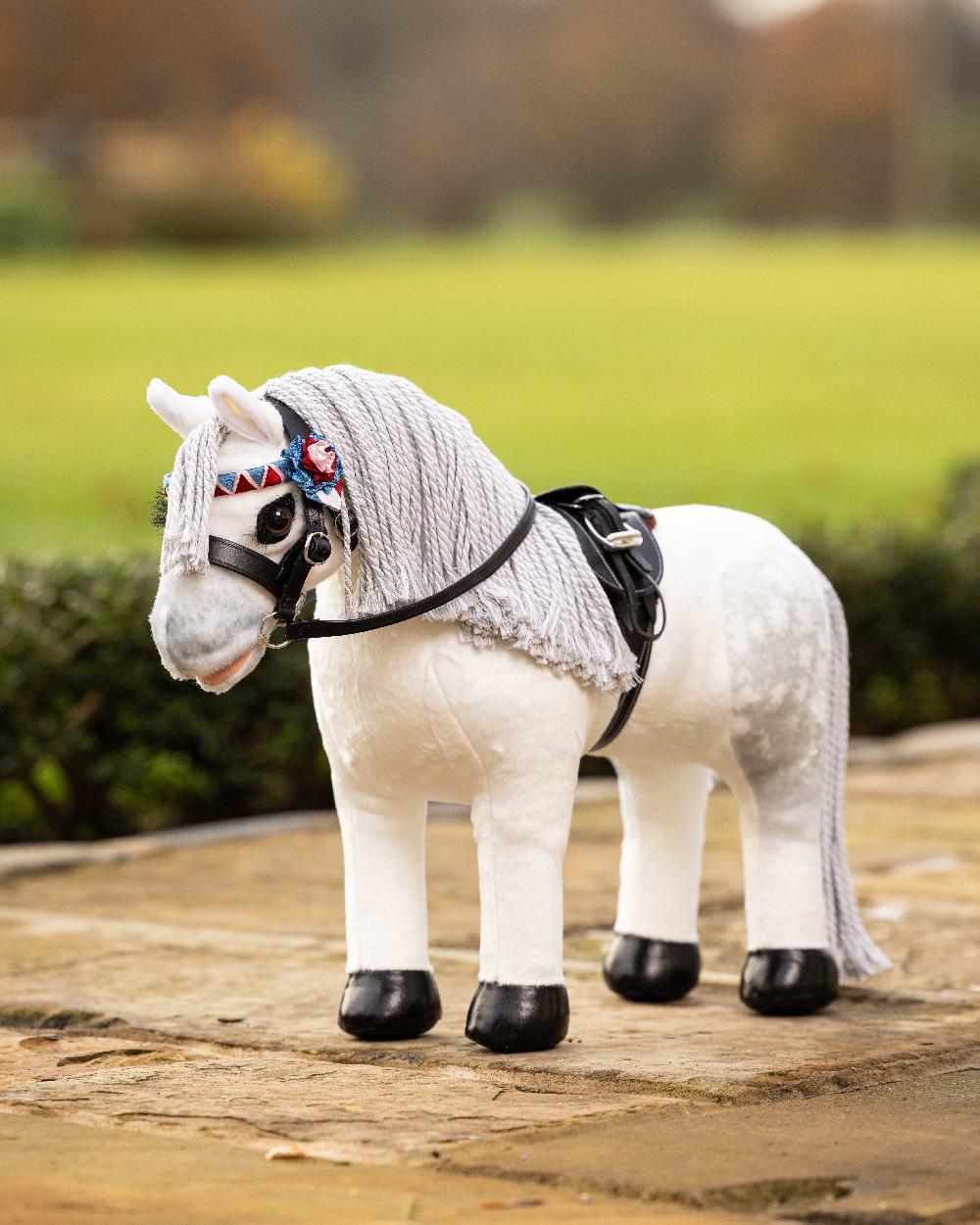 Black coloured LeMieux Toy Pony Showing Bridle on blurry background 