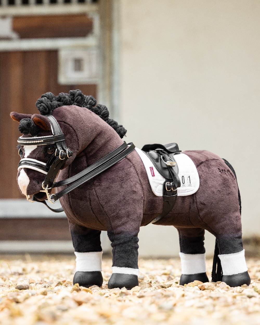 LeMieux Toy Pony Valegro on blurry house background