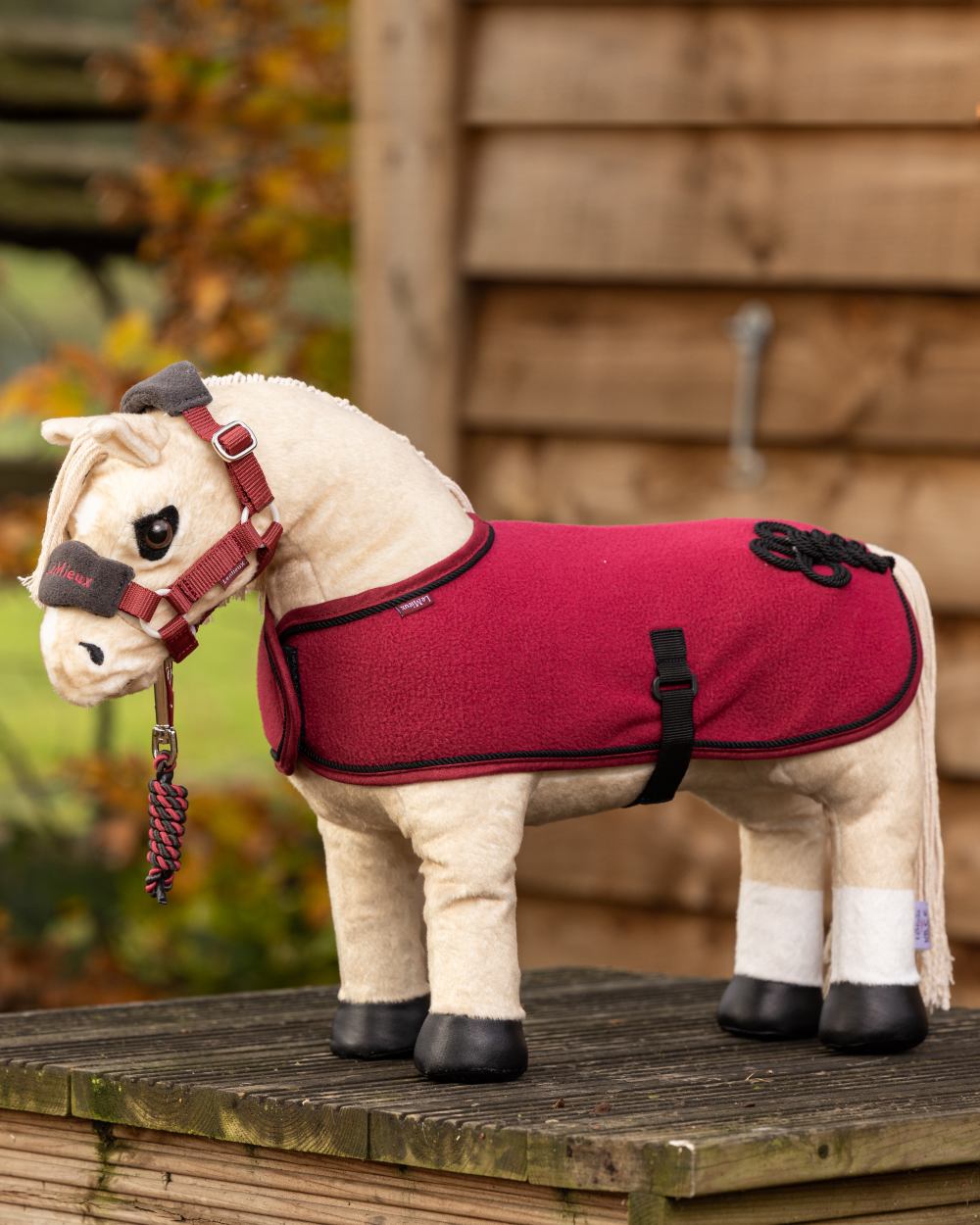 Ember coloured LeMieux Toy Pony Vogue Headcollar on blurry background 