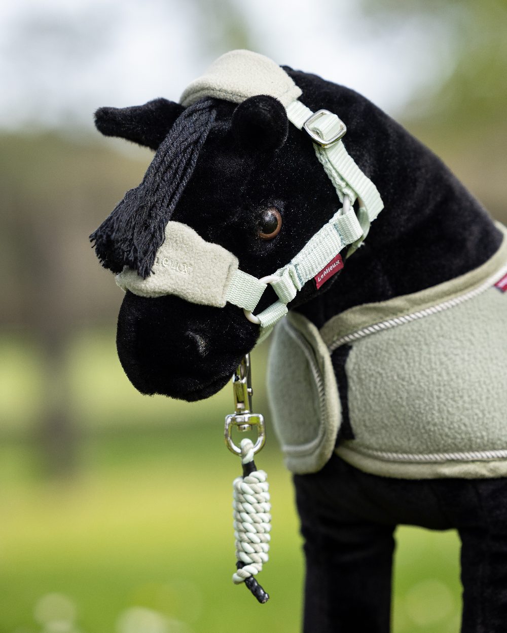 Fern coloured LeMieux Toy Pony Vogue Headcollar on blurry background 