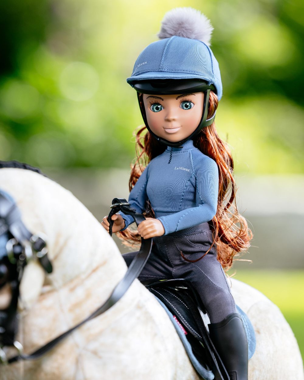 Ice Blue Coloured LeMieux Toy Rider Outfit on outdoor background 