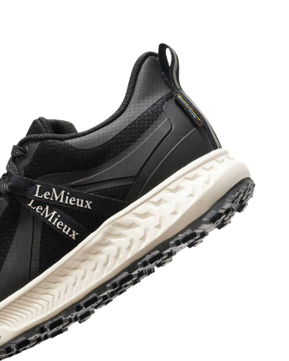 Black coloured LeMieux Trax Waterproof Trainers on white background 