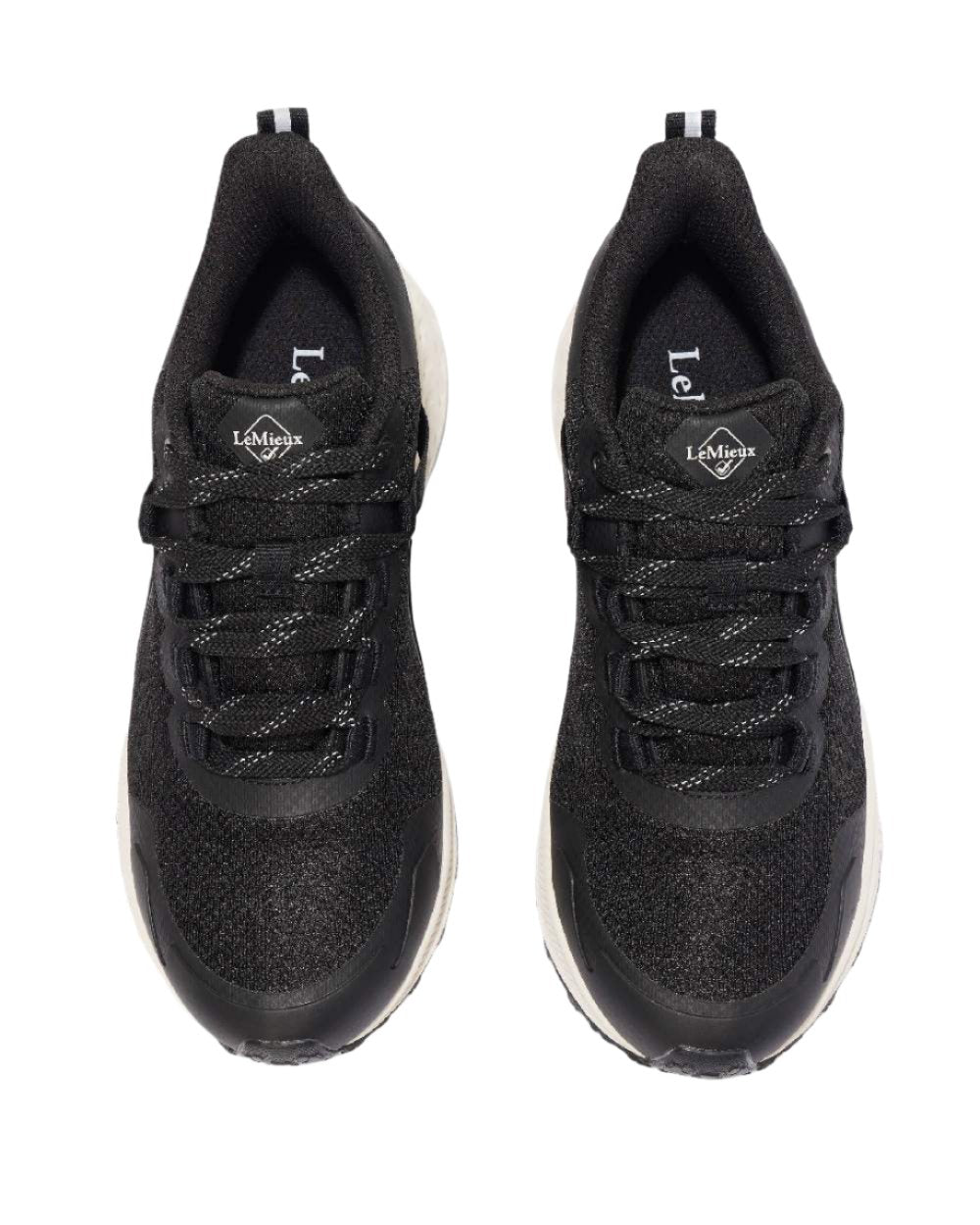 Black coloured LeMieux Trax Waterproof Trainers on white background 