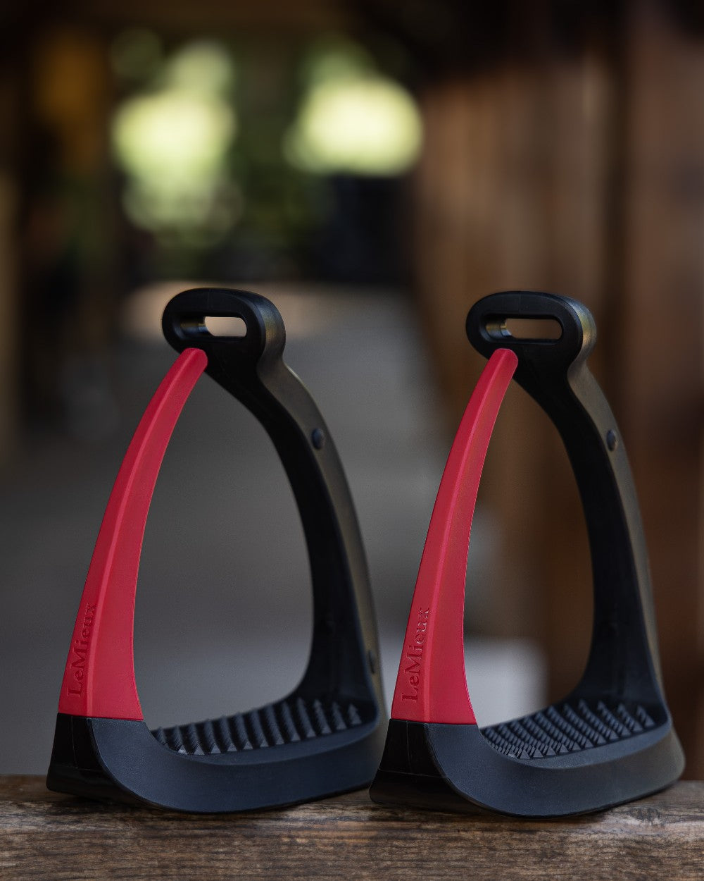 Chilli coloured LeMieux VectorFlex Stirrup Arm on outdoor background 