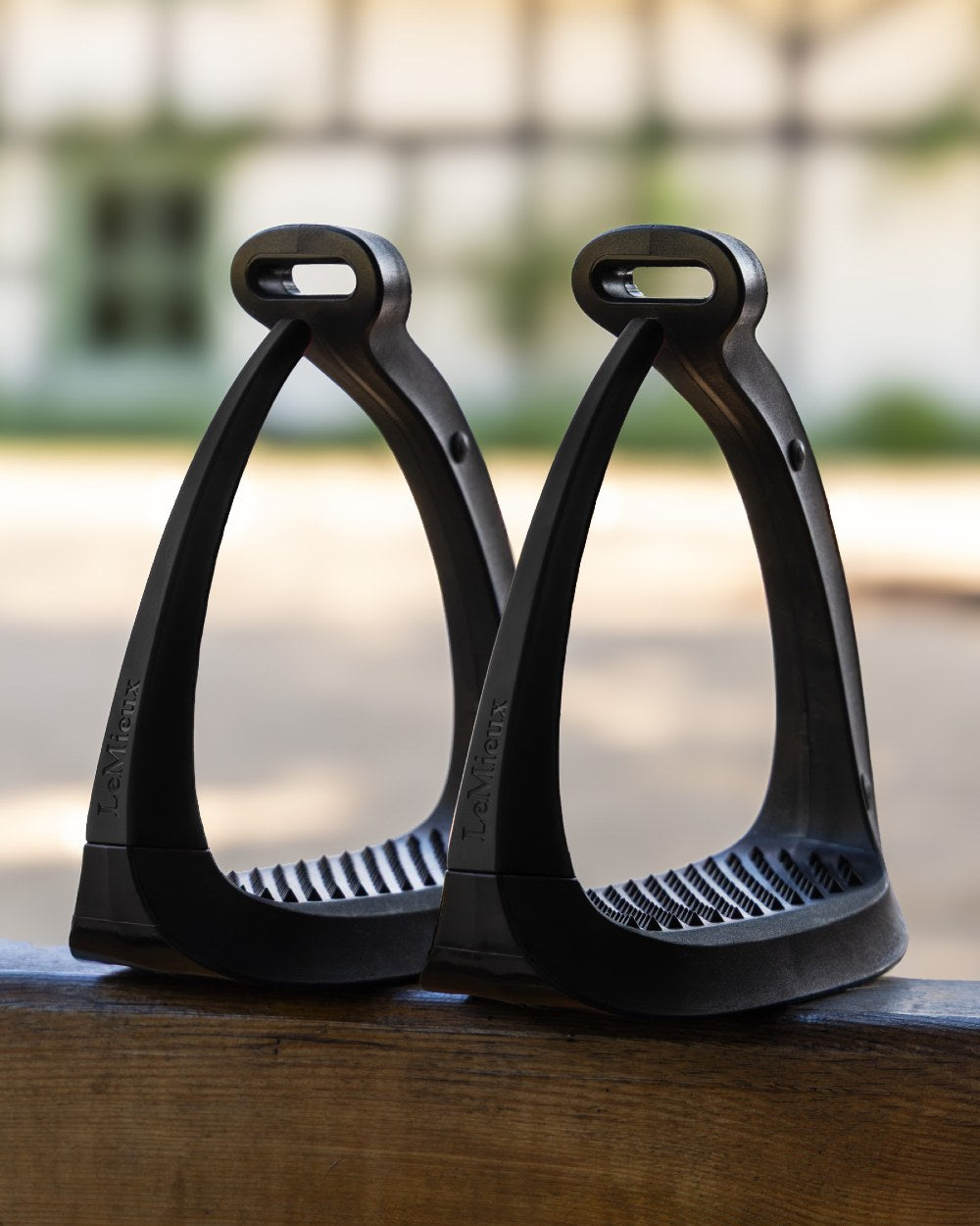 Black coloured LeMieux VectorFlex Stirrup Arm on outdoor background 