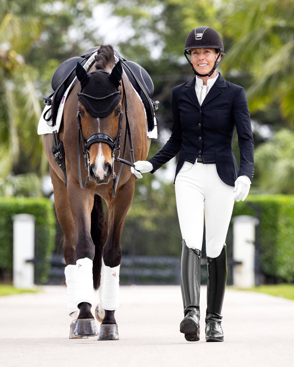 White coloured LeMieux Victoria Suede Seat Breeches on blurry green background 