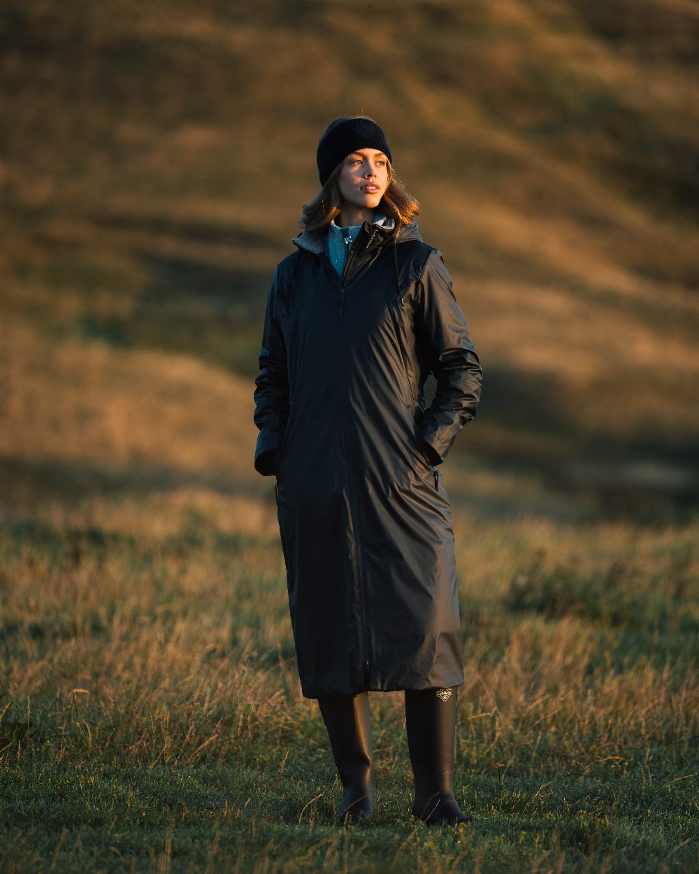 Navy Coloured LeMieux Elements Coat On A Land Background 