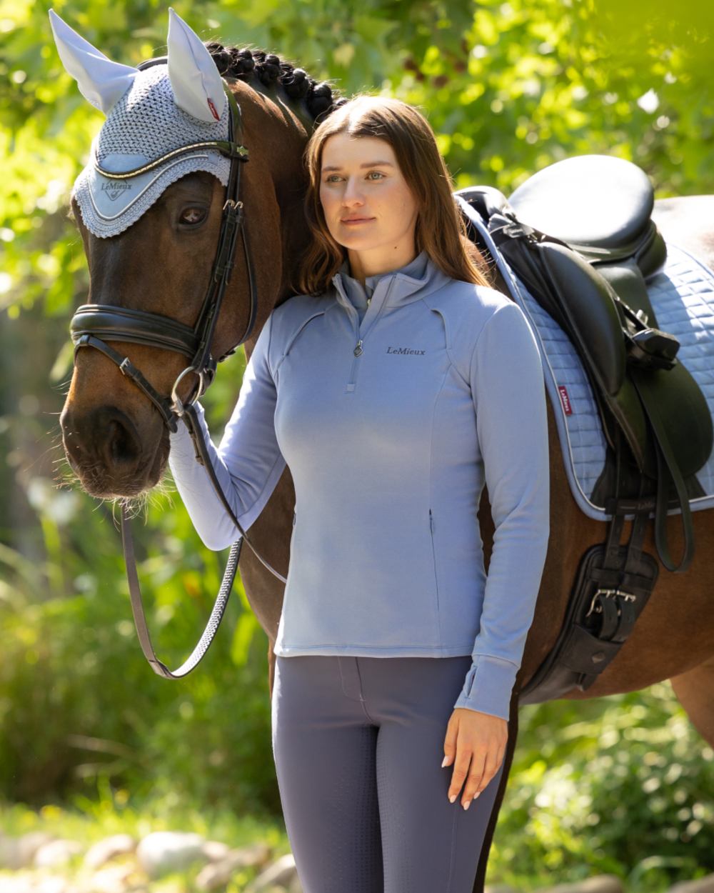Powder Blue coloured LeMieux Frances Quarter Zip Fleece on outdoor background 