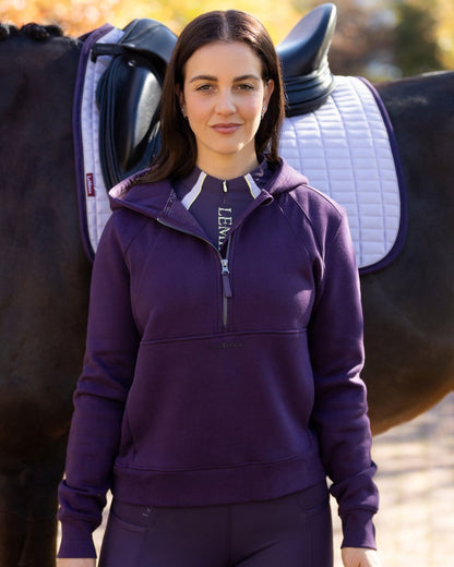 Juniper coloured LeMieux Womens Henrietta Half Zip Hoodie on blurry background 