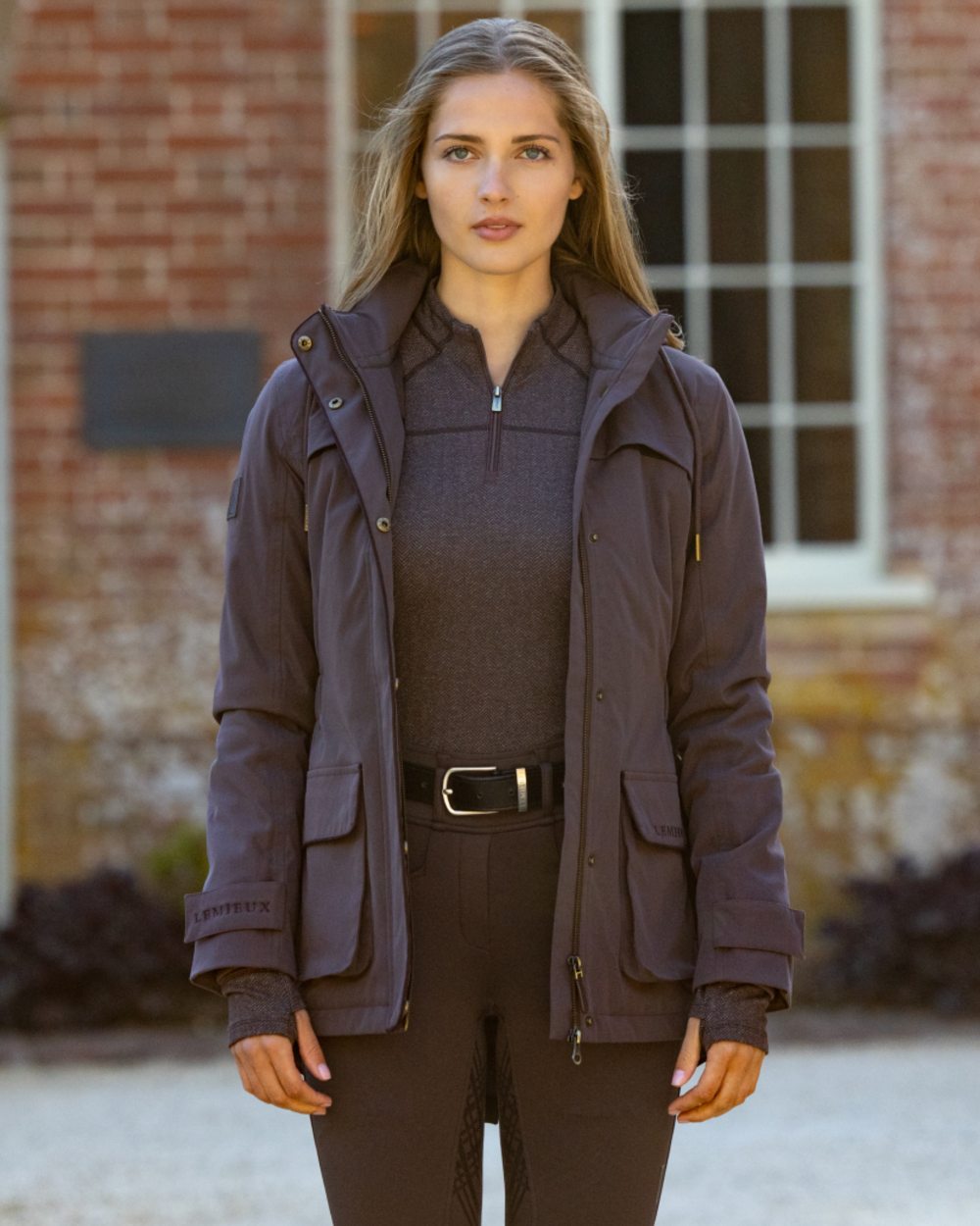 Cocoa coloured LeMieux Womens Heritage Beatrice Waterproof Coat on outdoor background 
