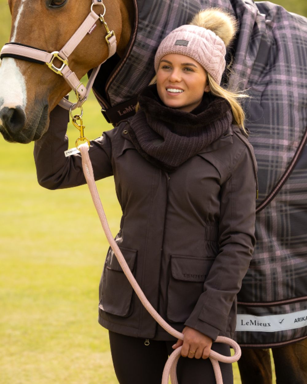Cocoa coloured LeMieux Womens Heritage Beatrice Waterproof Coat on outdoor background 
