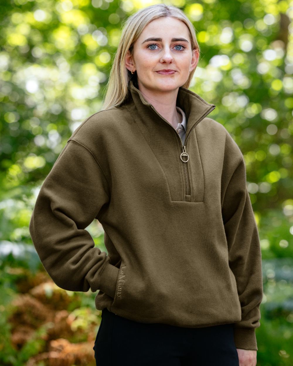 Alpine coloured LeMieux Womens Keira Quarter Neck Sweatshirt on tree background 