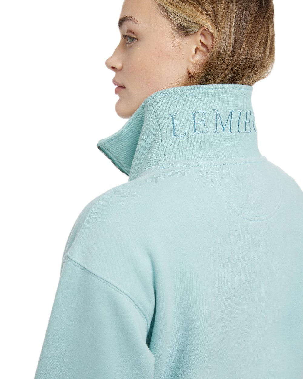 Aqua coloured LeMieux Womens Keira Quarter Neck Sweatshirt on white background 