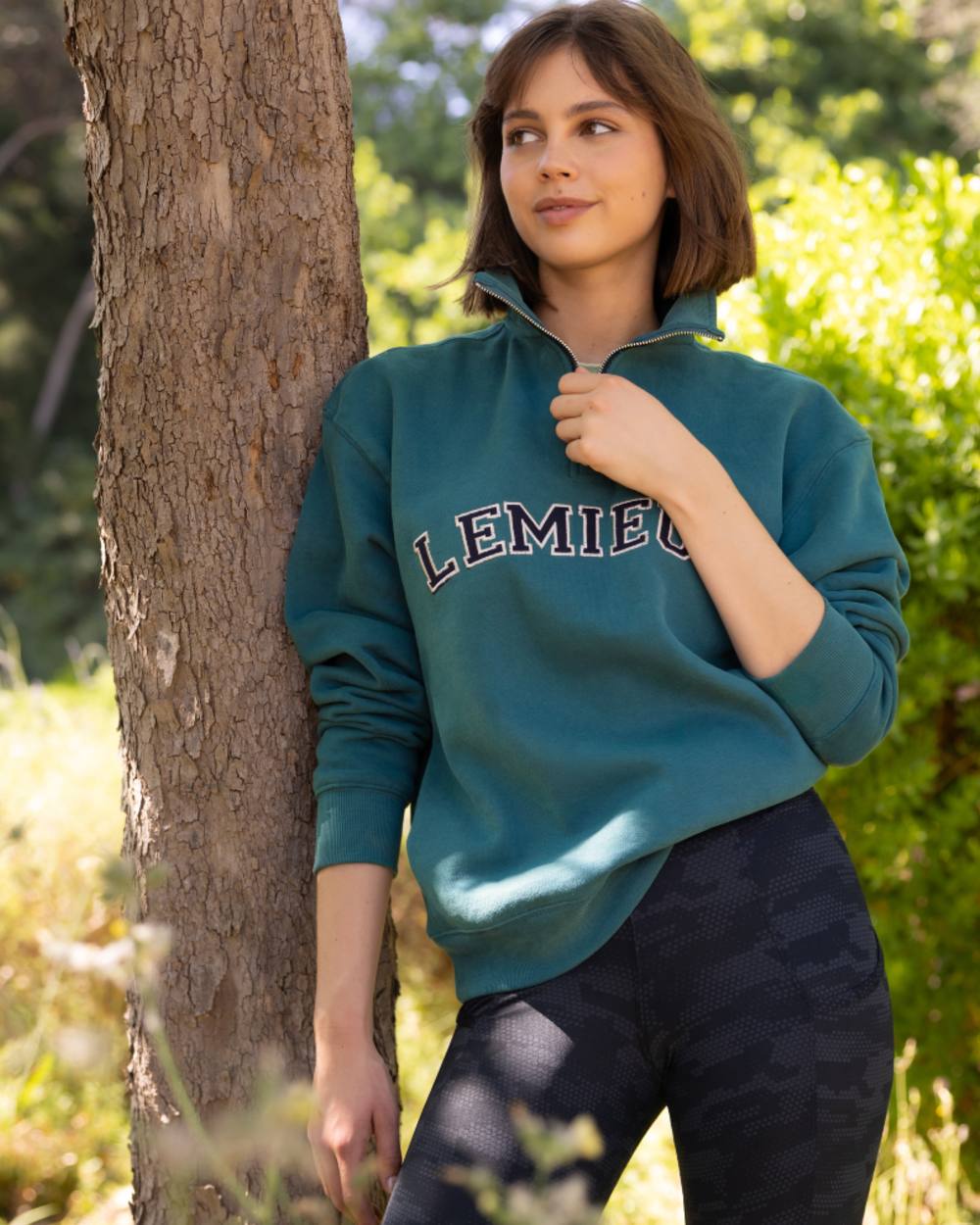 Jungle coloured LeMieux Womens Kelsie Quarter Neck Sweatshirt on outdoor background 