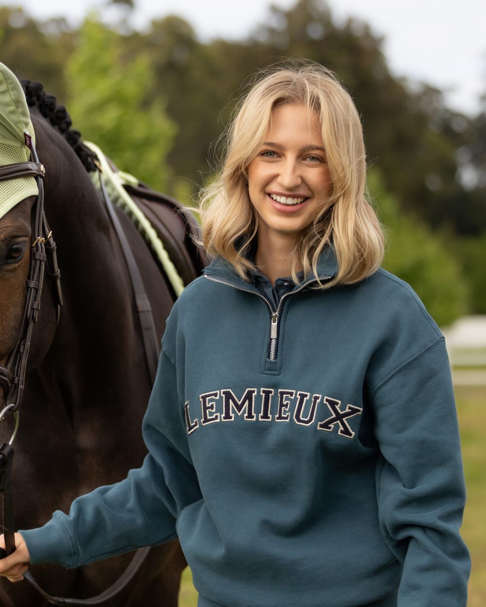 Jungle coloured LeMieux Womens Kelsie Quarter Neck Sweatshirt on outdoor background 