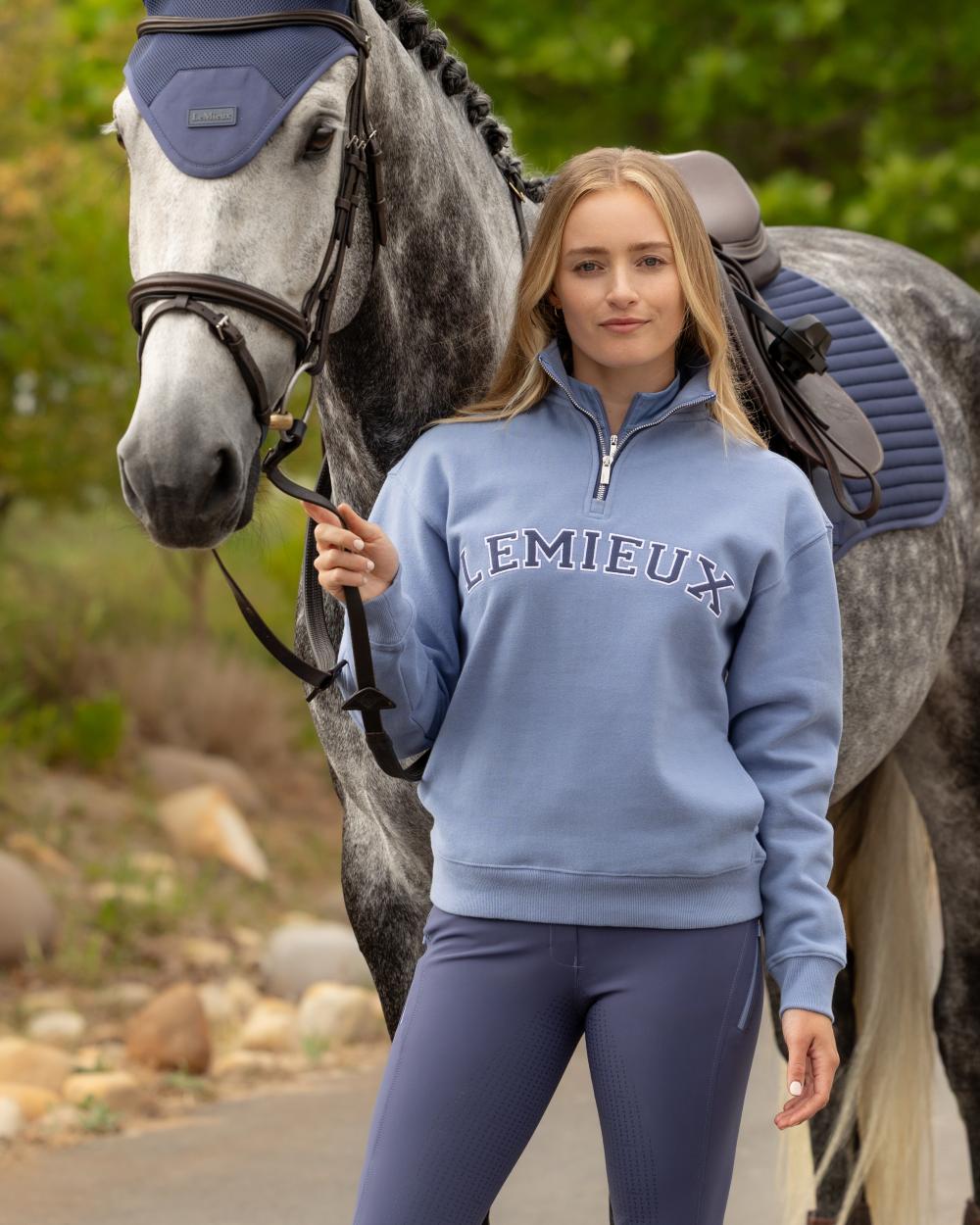 Powder Blue coloured LeMieux Womens Kelsie Quarter Neck Sweatshirt on outdoor background 