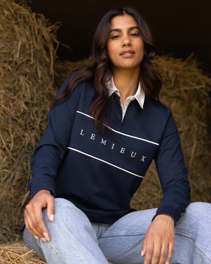 Navy coloured LeMieux Womens Rochelle Rugby Shirt on grass background 