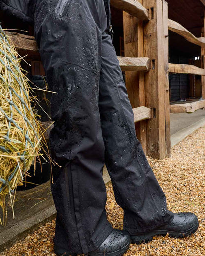 Black coloured LeMieux Womens Stormwear Waterproof Trousers on outdoor background 