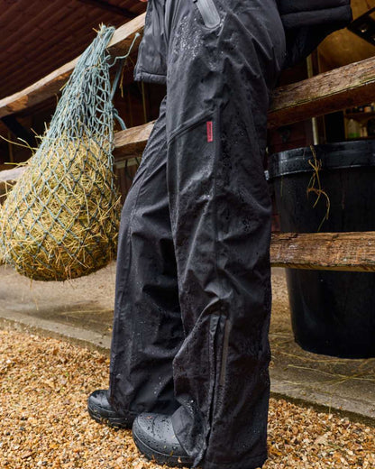 Black coloured LeMieux Womens Stormwear Waterproof Trousers on outdoor background 