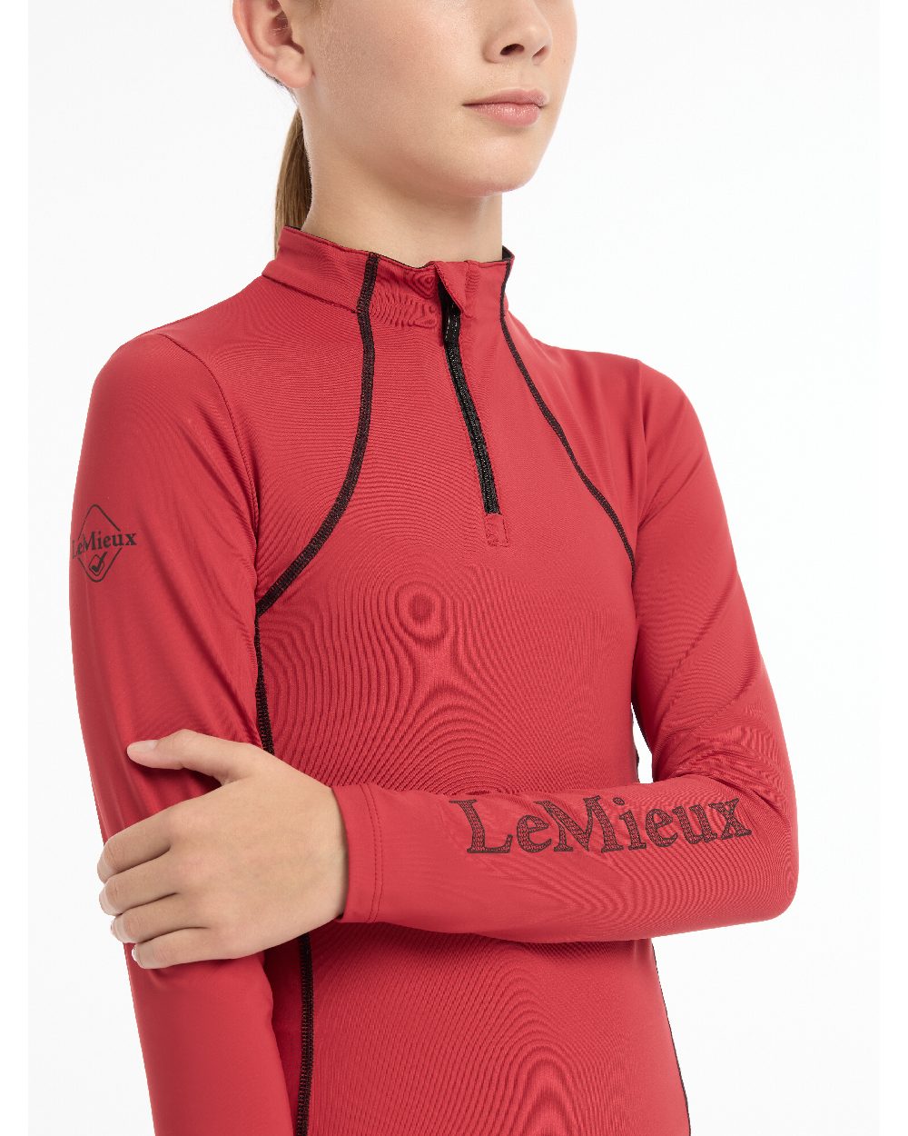 Chilli coloured LeMieux Young Rider Base Layer on white background 