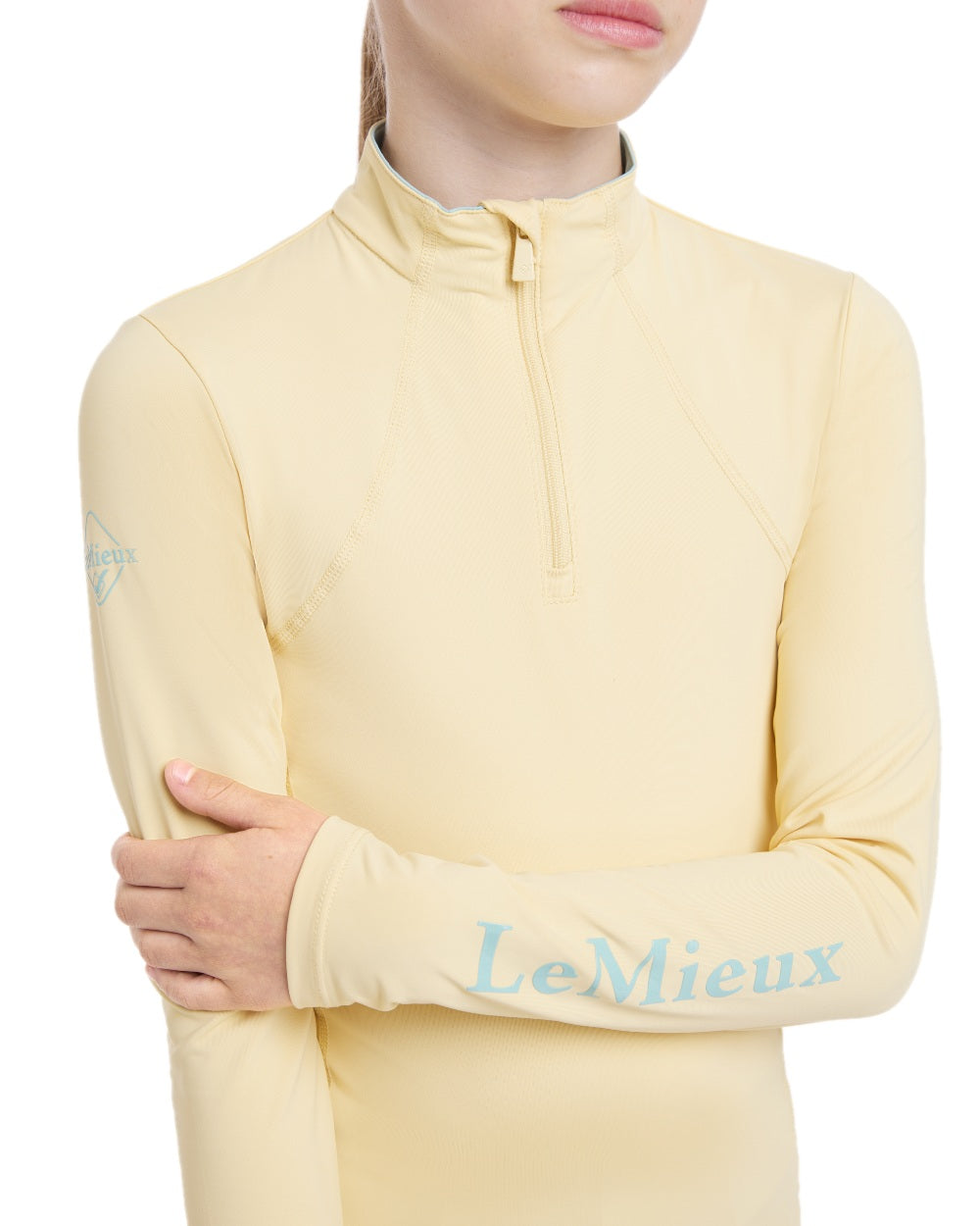 Mimosa coloured LeMieux Young Rider Base Layer on white background 