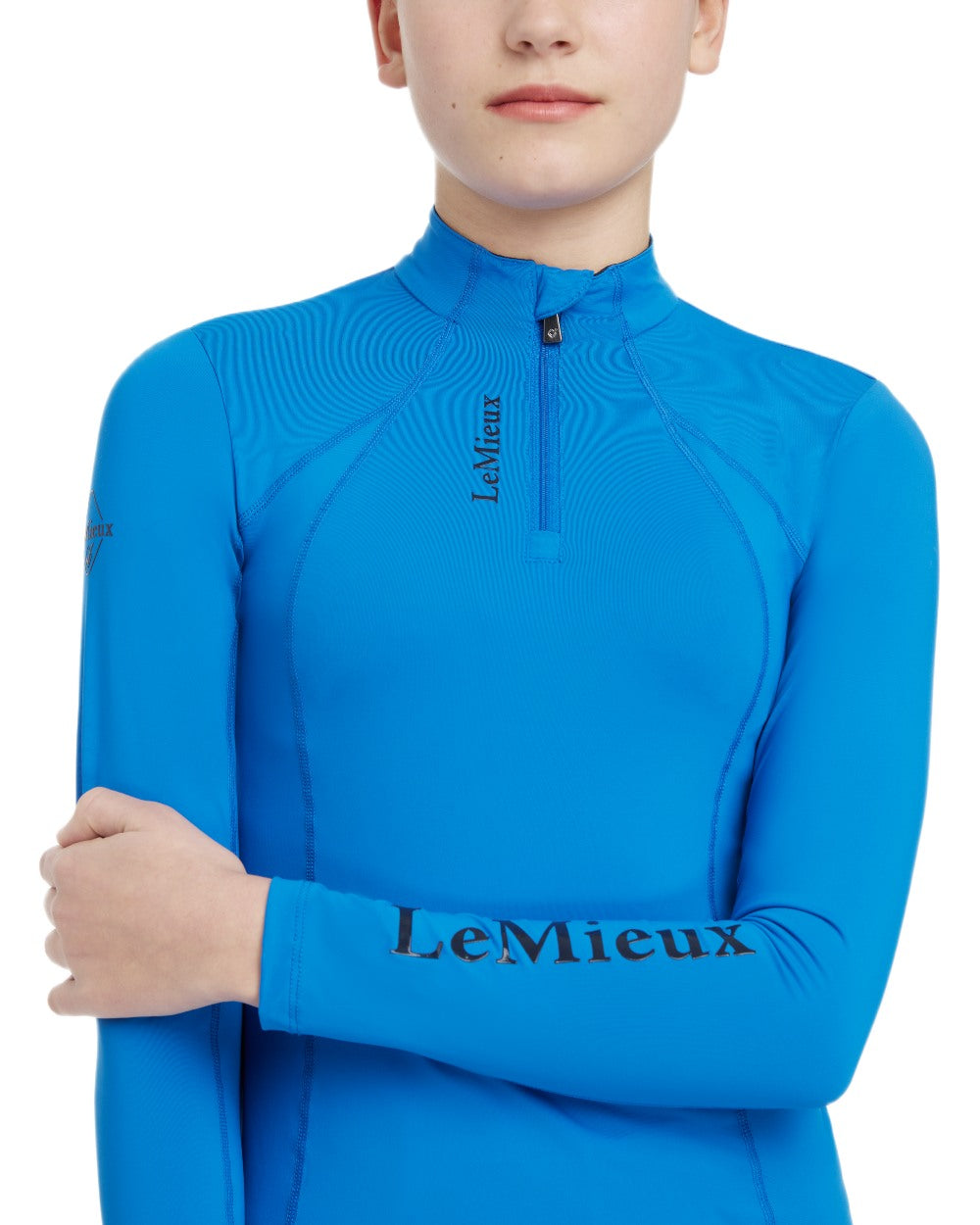 Benetton Blue coloured LeMieux Young Rider Classique Base Layer on white background 