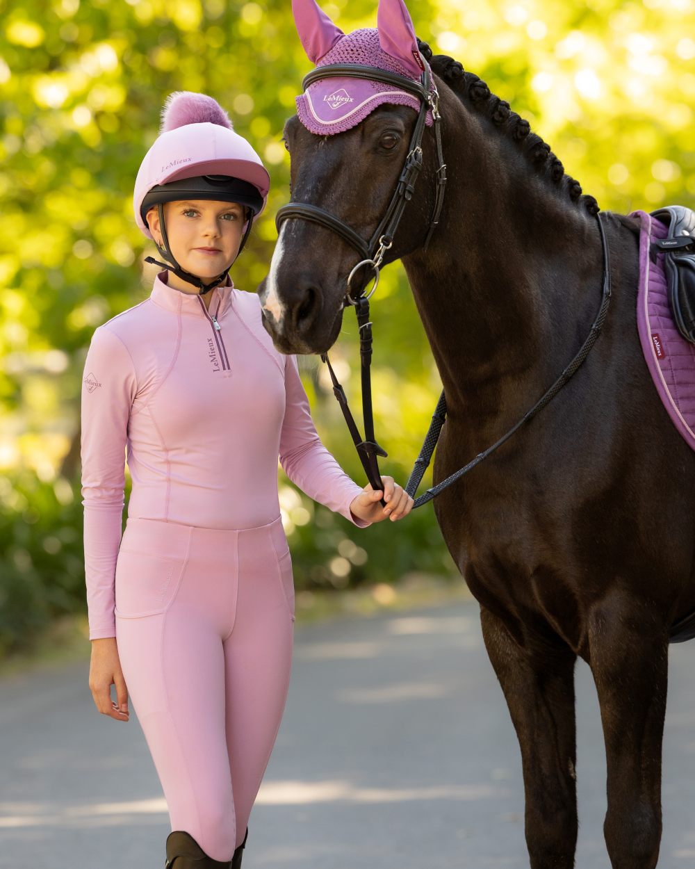 Fondant coloured LeMieux Young Rider Classique Base Layer on tree background 