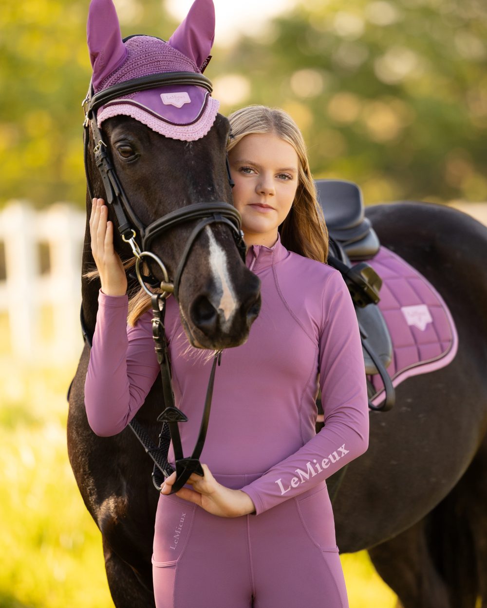 Mallow coloured LeMieux Young Rider Classique Base Layer on tree background 