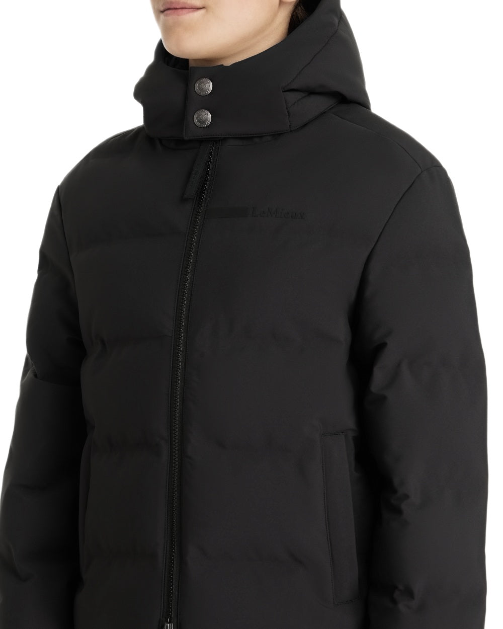 Black coloured LeMieux Young Rider Daisy Waterproof Coat on white background 