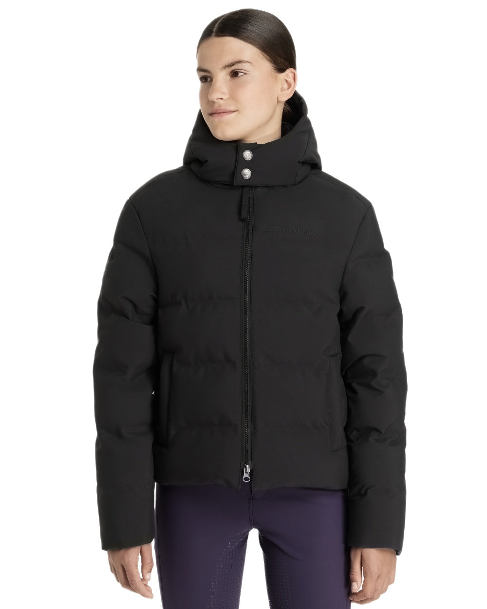 Black coloured LeMieux Young Rider Daisy Waterproof Coat on white background 