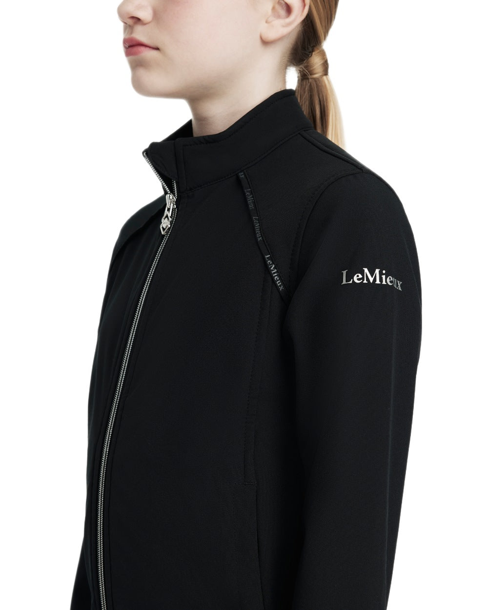 Black coloured LeMieux Young Rider Elite Softshell Jacket on white background 