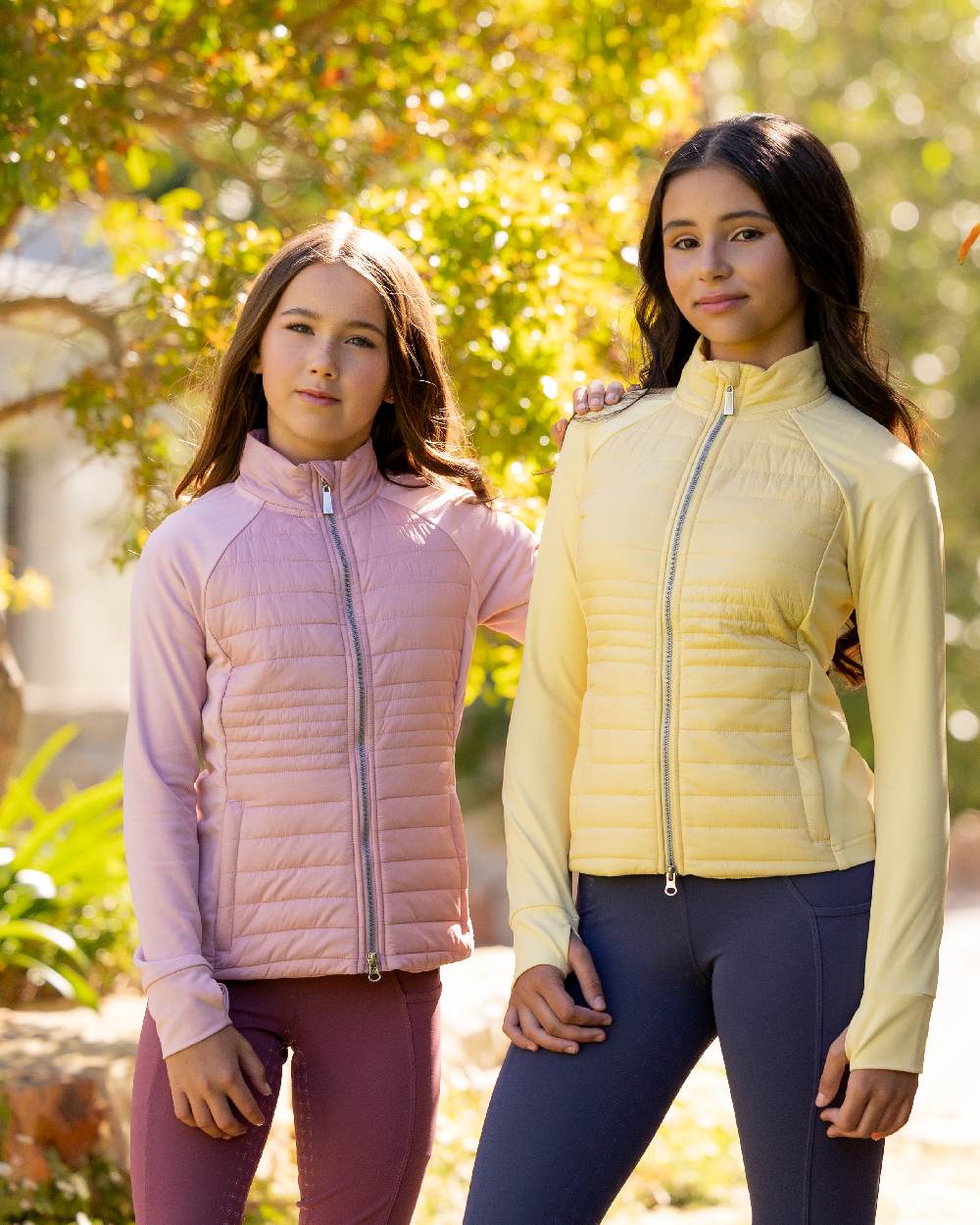 Blossom coloured LeMieux Young Rider Josephine Jacket on backyard background 