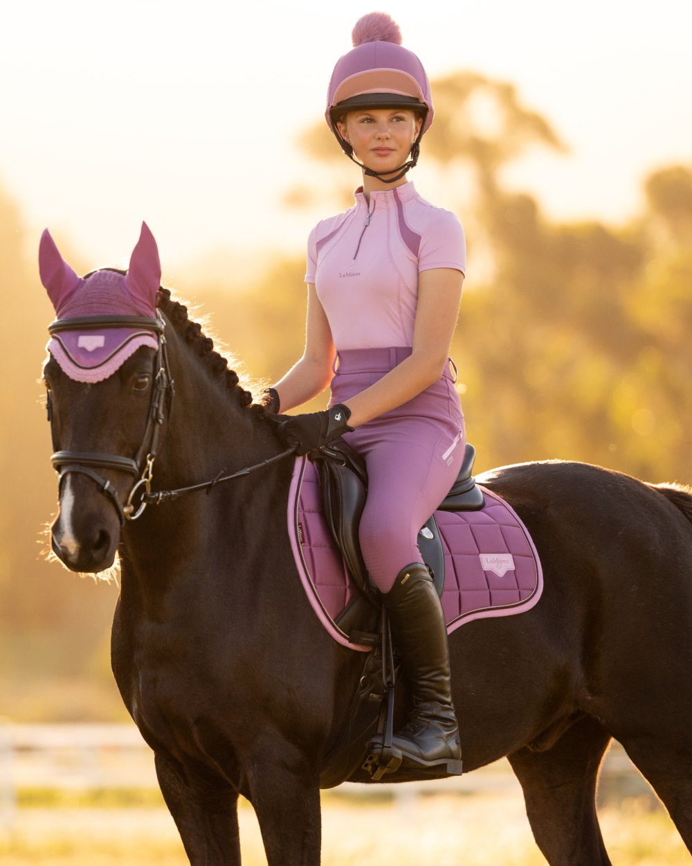 Fondant coloured LeMieux Young Rider Short Sleeve Mia Mesh Base Layer on outdoor background 