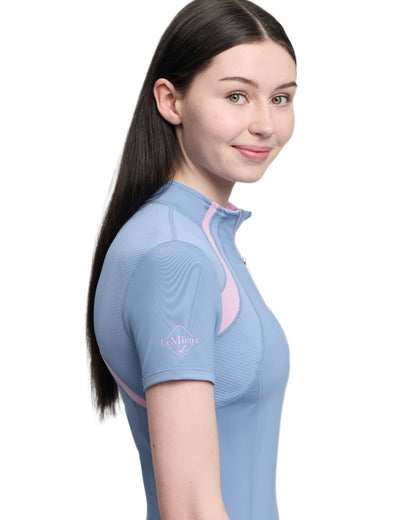 Powder Blue coloured LeMieux Young Rider Short Sleeve Mia Mesh Base Layer on white background 
