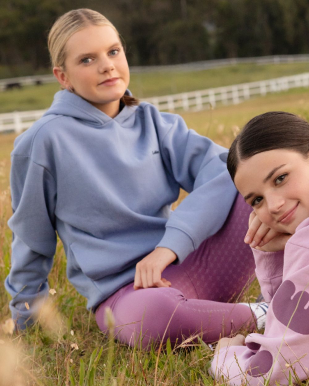 Powder Blue coloured LeMieux Young Rider Sia Hoodie on grass background 