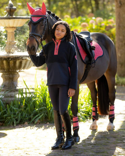 Navy coloured LeMieux Young Rider Tammy Teddy Fleece on garden background 