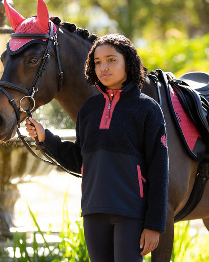 Navy coloured LeMieux Young Rider Tammy Teddy Fleece on garden background 