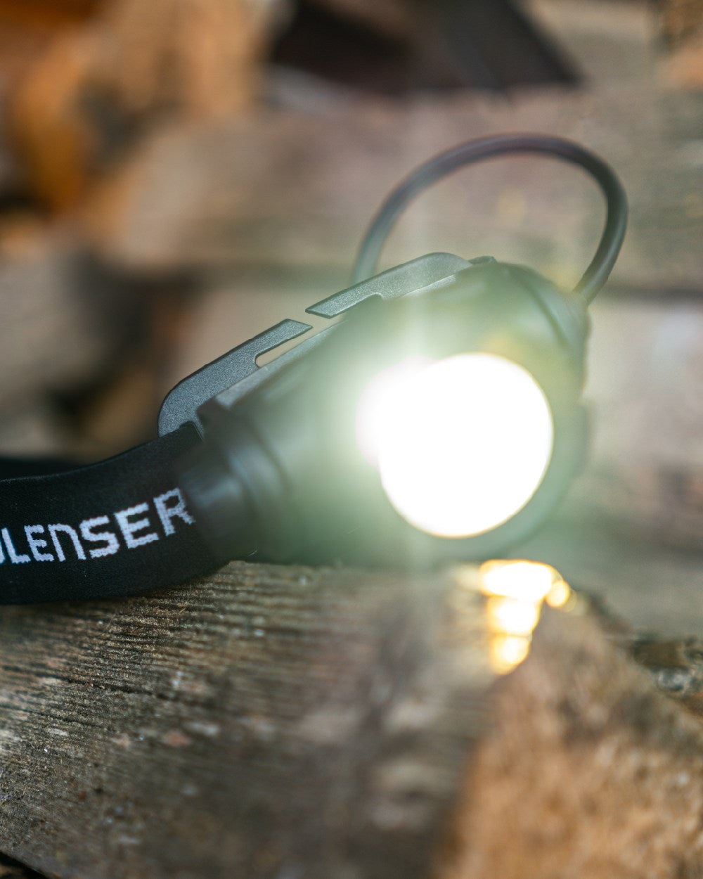 Black Coloured Led Lenser H7R Core Head Torch on blurry background 