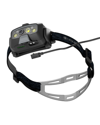 Black coloured Led Lenser HF8R Core Rechargeable Head Torch on white background