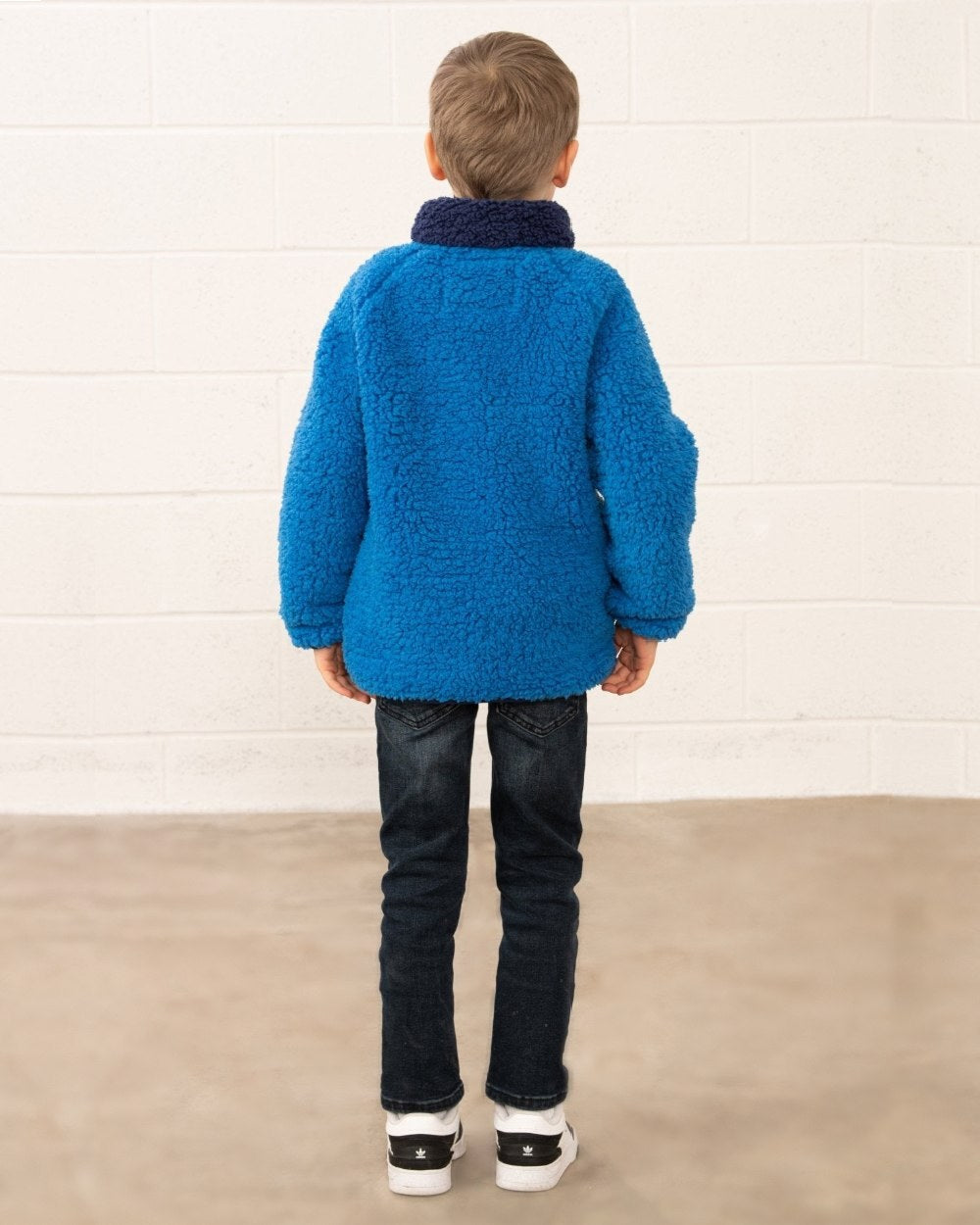 Blue Tractor coloured Lighthouse Childrens Caden Fleece on wall background 