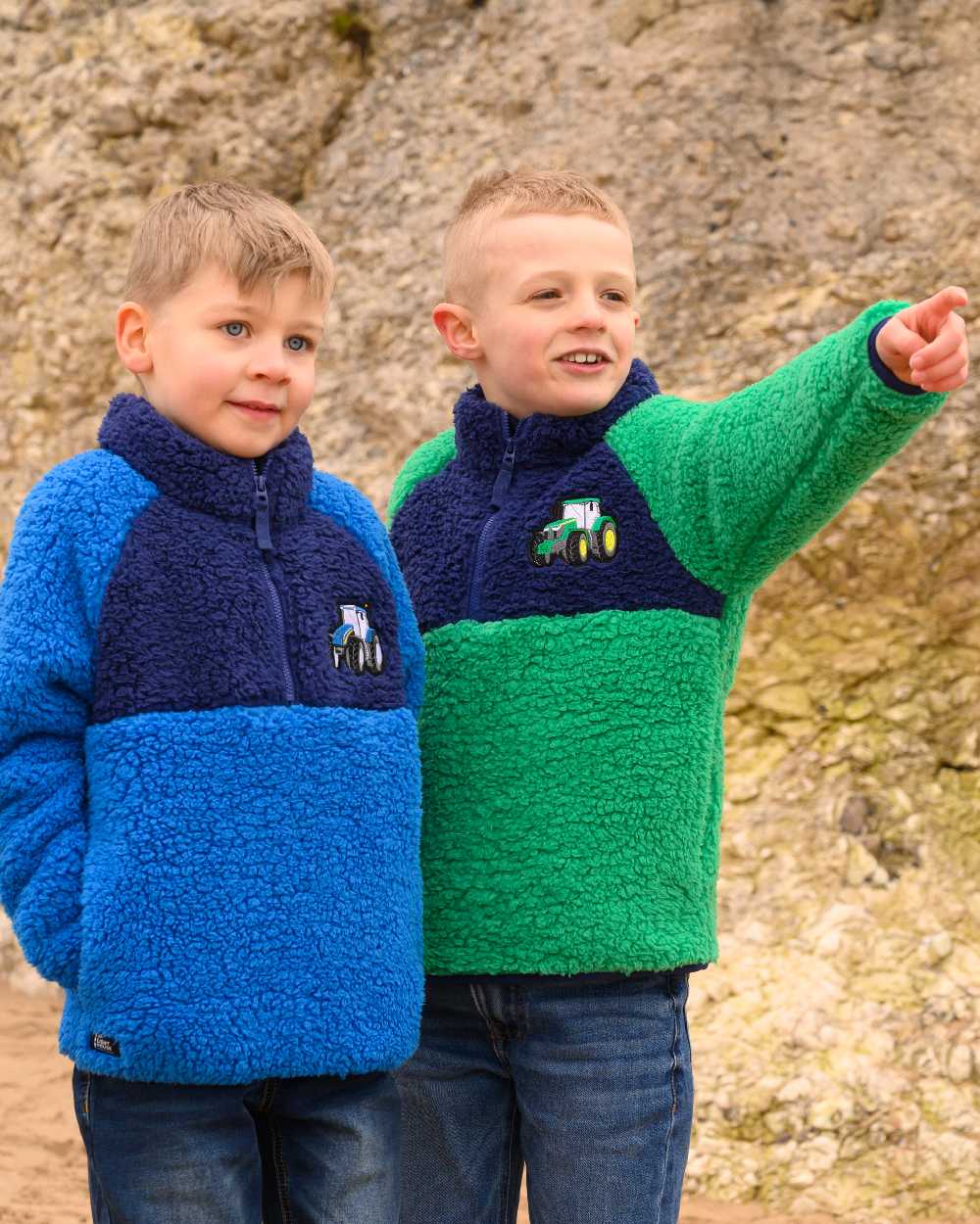 Green Tractor coloured Lighthouse Childrens Caden Fleece on rock background 